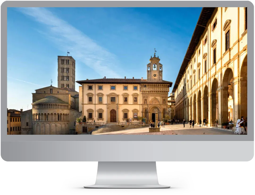 Computer con Immagine di Arezzo che mostra il servizio realizzazione siti web Arezzo