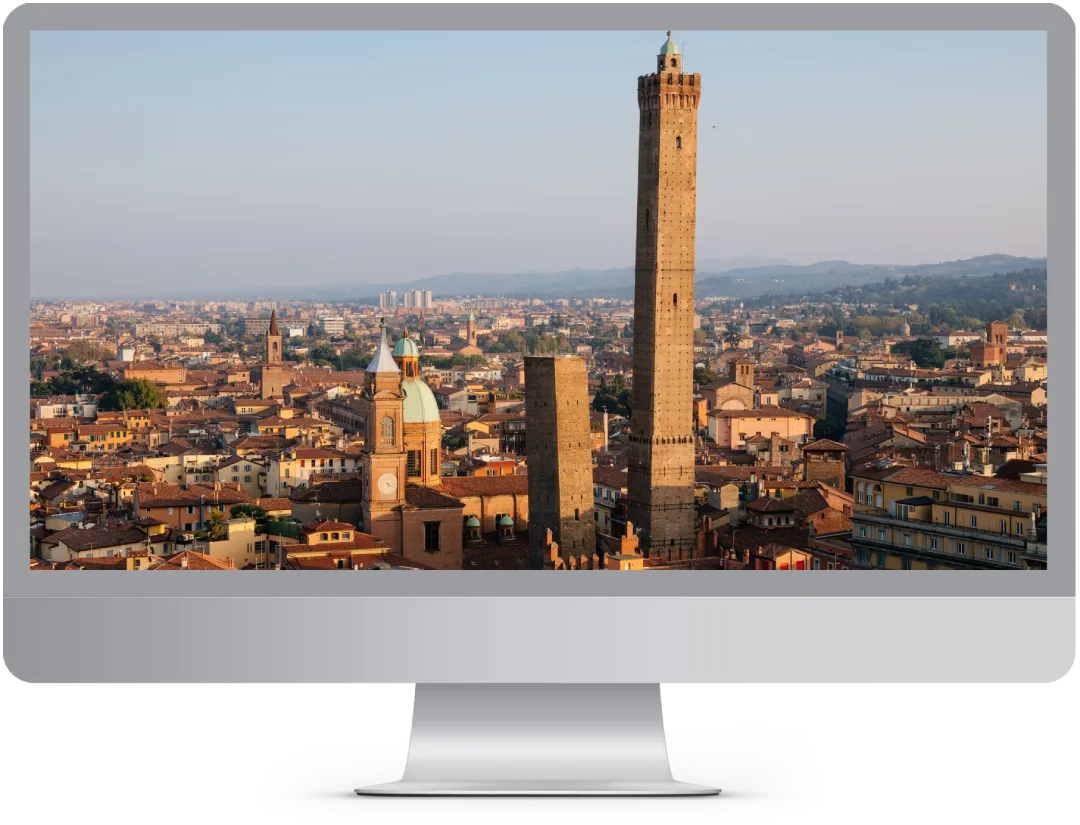 Computer con Immagine di Bologna per mostrare il servizio Realizzazione Siti Web Bologna